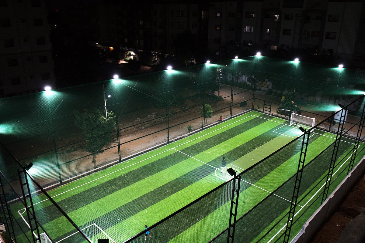 The turf under floodlights at night